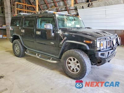 Czwarte zdjęcie samochodu z boku: 2004 HUMMER H2 VIN:5GRGN23U74H107367 - miniatura