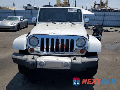 Piąte zdjęcie samochodu w środku: 2012 JEEP WRANGLER UNLIMITED SAHARA VIN:1C4HJWEG9CL123176 - miniatura
