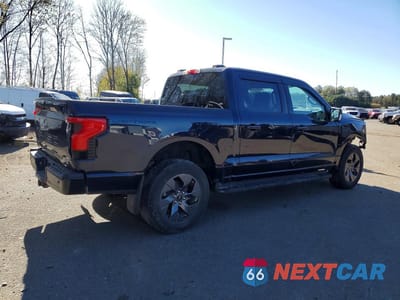 Trzecie zdjęcie samochodu z tyłu: 2023 FORD F150 LIGHTNING PRO VIN:1FT6W1EV9PWG42582 - miniatura