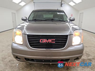 Piąte zdjęcie samochodu w środku: 2011 GMC YUKON SLE VIN:1GKS2AE00BR273699 - miniatura