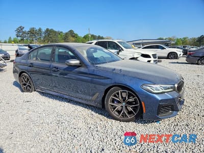 Czwarte zdjęcie samochodu z boku: 2023 BMW M550XI VIN:WBA13BK03PCM30373 - miniatura