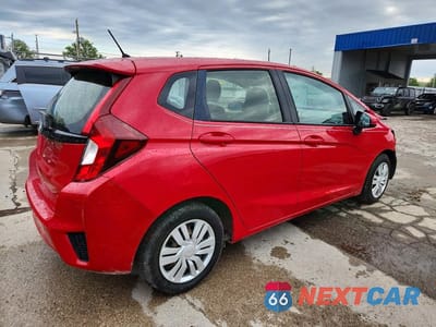 Trzecie zdjęcie samochodu z tyłu: 2016 HONDA FIT LX VIN:JHMGK5H51GX006881 - miniatura