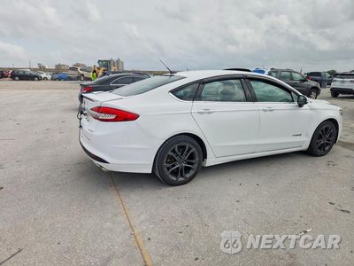 Trzecie zdjęcie samochodu z tyłu: 2018 FORD FUSION SE HYBRID VIN:3FA6P0LU8JR116378 - miniatura