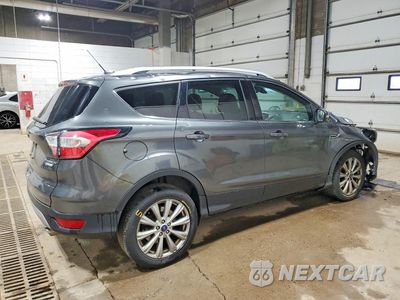 Trzecie zdjęcie samochodu z tyłu: 2017 FORD ESCAPE TITANIUM VIN:1FMCU0J91HUB56742 - miniatura