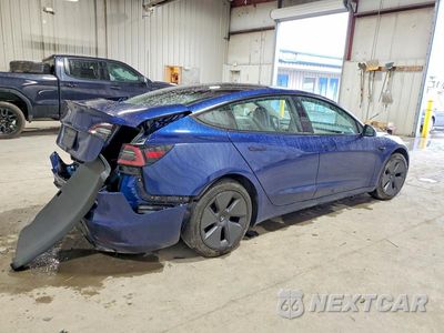 Trzecie zdjęcie samochodu z tyłu: 2023 TESLA MODEL 3 VIN:5YJ3E1EA1PF465713 - miniatura