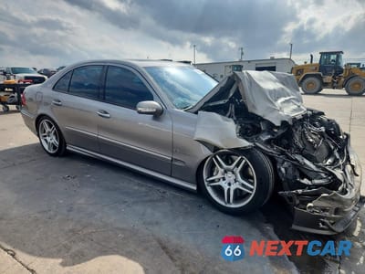 Czwarte zdjęcie samochodu z boku: 2003 MERCEDES-BENZ E 55 AMG VIN:WDBUF76J73A307719 - miniatura