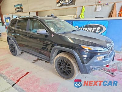 Czwarte zdjęcie samochodu z boku: 2014 JEEP CHEROKEE TRAILHAWK VIN:1C4PJMBS3EW131333 - miniatura