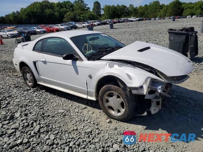 Czwarte zdjęcie samochodu z boku: 1999 FORD MUSTANG VIN:1FAFP4040XF132365 - miniatura