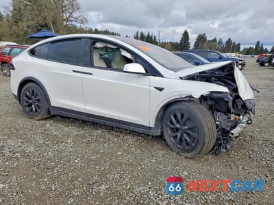 Czwarte zdjęcie samochodu z boku: 2022 TESLA MODEL X VIN:7SAXCDE51NF335684 - miniatura