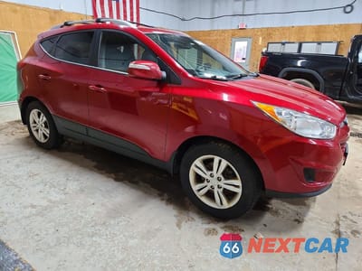 Czwarte zdjęcie samochodu z boku: 2012 HYUNDAI TUCSON GLS VIN:KM8JUCAC2CU397559 - miniatura
