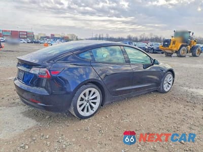 Trzecie zdjęcie samochodu z tyłu: 2023 TESLA MODEL 3 VIN:5YJ3E1EA4PF450784 - miniatura