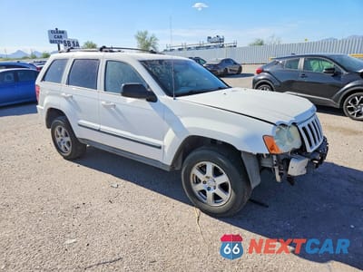 Czwarte zdjęcie samochodu z boku: 2009 JEEP GRAND CHEROKEE LAREDO VIN:1J8GR48K19C516597 - miniatura