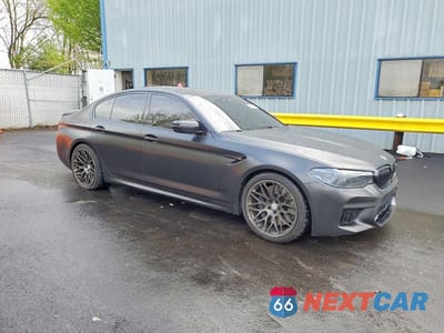 Czwarte zdjęcie samochodu z boku: 2019 BMW M5 VIN:WBSJF0C59KB448442 - miniatura