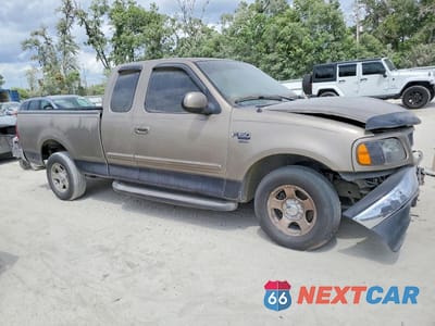 Czwarte zdjęcie samochodu z boku: 2001 FORD F150 VIN:1FTRX17L01NA35781 - miniatura
