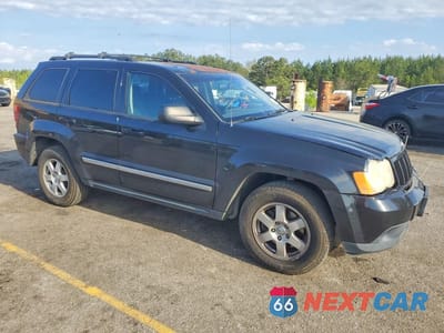 Czwarte zdjęcie samochodu z boku: 2010 JEEP GRAND CHEROKEE LAREDO VIN:1J4PS4GKXAC112516 - miniatura