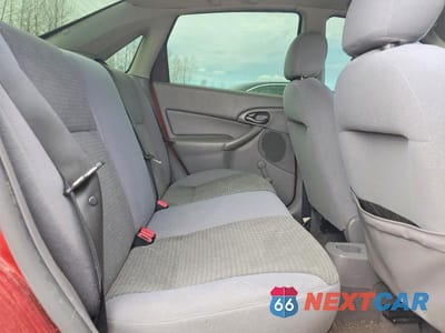 Zdjęcie 10 z 13 samochodu: 2004 FORD FOCUS LX VIN:1FAFP33P14W132192 - miniatura