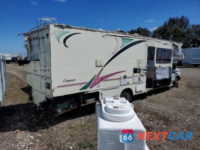 Czwarte zdjęcie samochodu z boku: 1999 FORD ECONOLINE E450 SUPER DUTY CUTAWAY VAN RV VIN:1FDXE40SXXHB08478 - miniatura
