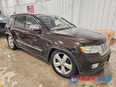 Czwarte zdjęcie samochodu z boku: 2011 JEEP GRAND CHEROKEE OVERLAND VIN:1J4RR6GT6BC623022 - miniatura