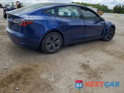 Trzecie zdjęcie samochodu z tyłu: 2023 TESLA MODEL 3 VIN:5YJ3E1EA8PF457690 - miniatura