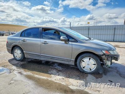 Czwarte zdjęcie samochodu z boku: 2007 HONDA CIVIC HYBRID VIN:JHMFA36237S006003 - miniatura