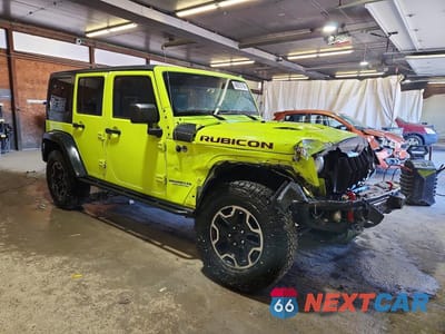 Czwarte zdjęcie samochodu z boku: 2016 JEEP WRANGLER UNLIMITED RUBICON VIN:1C4BJWFG8GL335674 - miniatura