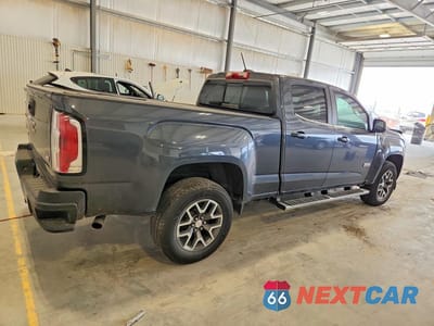 Trzecie zdjęcie samochodu z tyłu: 2016 GMC CANYON SLE VIN:1GTG6CE37G1115216 - miniatura