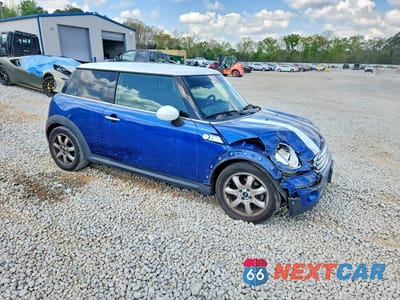 Czwarte zdjęcie samochodu z boku: 2009 MINI COOPER VIN:WMWMF33549TU70128 - miniatura