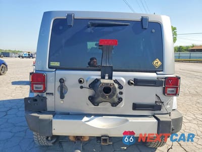 Zdjęcie 6 z 12 samochodu: 2013 JEEP WRANGLER UNLIMITED SAHARA VIN:1C4BJWEG7DL662953 - miniatura