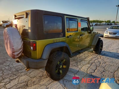 Trzecie zdjęcie samochodu z tyłu: 2010 JEEP WRANGLER UNLIMITED SPORT VIN:1J4BA3H13AL202040 - miniatura