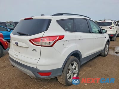 Trzecie zdjęcie samochodu z tyłu: 2016 FORD ESCAPE SE VIN:1FMCU9GX6GUC32576 - miniatura