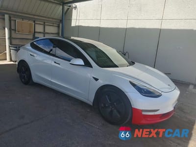 Czwarte zdjęcie samochodu z boku: 2021 TESLA MODEL 3 VIN:5YJ3E1EA2MF917311 - miniatura