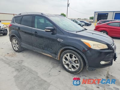 Czwarte zdjęcie samochodu z boku: 2014 FORD ESCAPE TITANIUM VIN:1FMCU0J93EUB10180 - miniatura