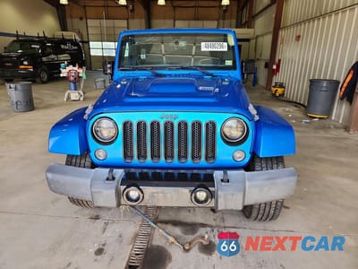 Piąte zdjęcie samochodu w środku: 2015 JEEP WRANGLER UNLIMITED SAHARA VIN:1C4BJWEG8FL685189 - miniatura