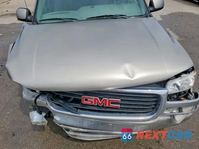 Zdjęcie 12 z 13 samochodu: 2002 GMC YUKON VIN:1GKEC13V42R251696 - miniatura