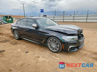 Czwarte zdjęcie samochodu z boku: 2018 BMW M550XI VIN:WBAJB9C50JB049454 - miniatura