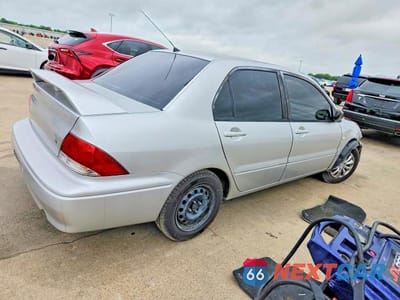 Trzecie zdjęcie samochodu z tyłu: 2002 MITSUBISHI LANCER ES VIN:JA3AJ26E02U016905 - miniatura