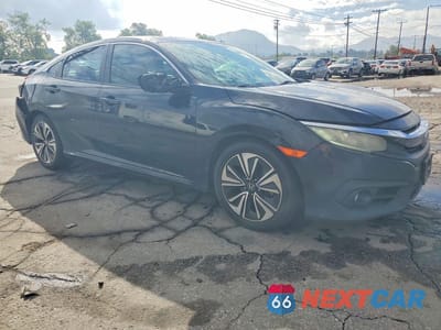 Czwarte zdjęcie samochodu z boku: 2016 HONDA CIVIC VIN:2HGFC1F71GH650300 - miniatura