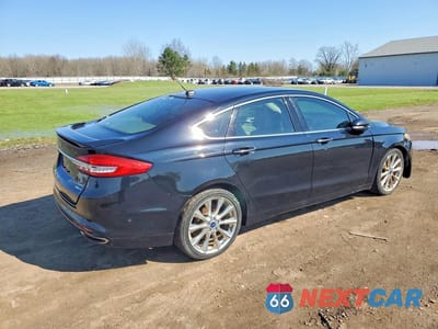 Trzecie zdjęcie samochodu z tyłu: 2017 FORD FUSION TITANIUM VIN:3FA6P0D93HR273417 - miniatura
