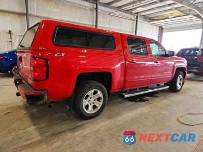 Trzecie zdjęcie samochodu z tyłu: 2018 CHEVROLET SILVERADO K1500 LT VIN:3GCUKRECXJG436161 - miniatura
