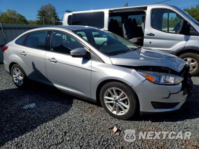 Czwarte zdjęcie samochodu z boku: 2018 FORD FOCUS SE VIN:1FADP3F29JL306661 - miniatura