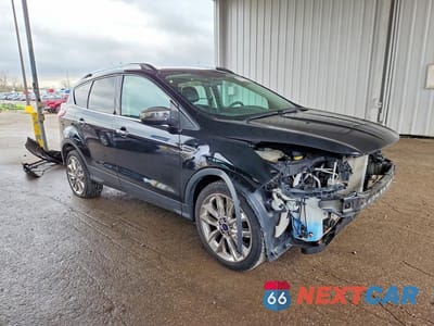 Czwarte zdjęcie samochodu z boku: 2016 FORD ESCAPE SE VIN:1FMCU9GX0GUB54750 - miniatura