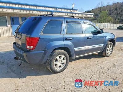 Trzecie zdjęcie samochodu z tyłu: 2010 JEEP GRAND CHEROKEE LAREDO VIN:1J4PR4GK3AC142923 - miniatura