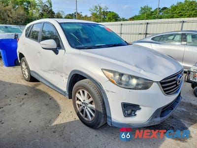Czwarte zdjęcie samochodu z boku: 2016 MAZDA CX-5 TOURING VIN:JM3KE4CY9G0760755 - miniatura
