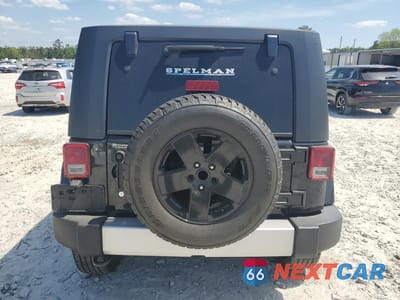 Zdjęcie 6 z 12 samochodu: 2010 JEEP WRANGLER UNLIMITED SAHARA VIN:1J4HA5H15AL213434 - miniatura