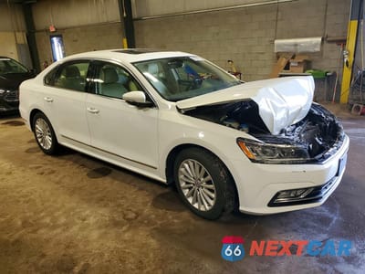 Czwarte zdjęcie samochodu z boku: 2016 VOLKSWAGEN PASSAT SE VIN:1VWBT7A34GC065862 - miniatura