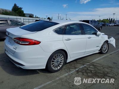 Trzecie zdjęcie samochodu z tyłu: 2018 FORD FUSION SE HYBRID VIN:3FA6P0LU7JR118817 - miniatura