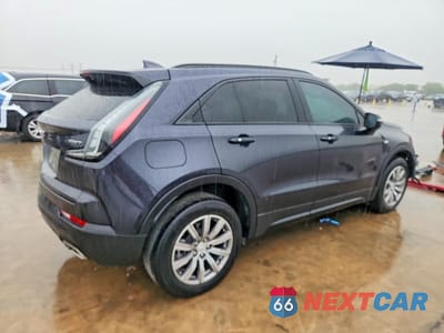 Trzecie zdjęcie samochodu z tyłu: 2022 CADILLAC XT4 SPORT VIN:1GYFZER43NF122966 - miniatura