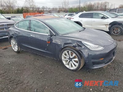 Czwarte zdjęcie samochodu z boku: 2018 TESLA MODEL 3 VIN:5YJ3E1EB2JF071816 - miniatura