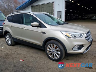 Czwarte zdjęcie samochodu z boku: 2017 FORD ESCAPE TITANIUM VIN:1FMCU9J97HUD80568 - miniatura