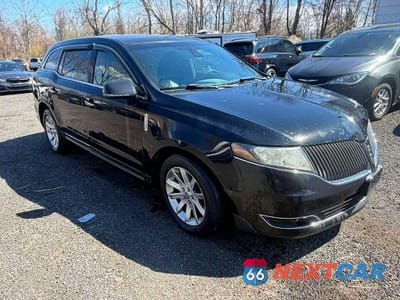 Czwarte zdjęcie samochodu z boku: 2013 LINCOLN MKT VIN:2LMHJ5NKXDBL53079 - miniatura